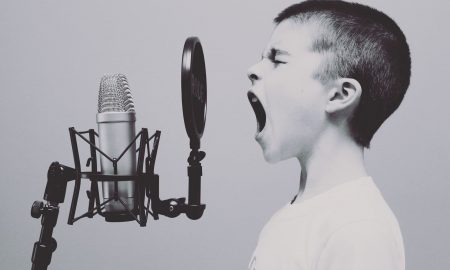 Boy singing into microphone about authentic brand purpose