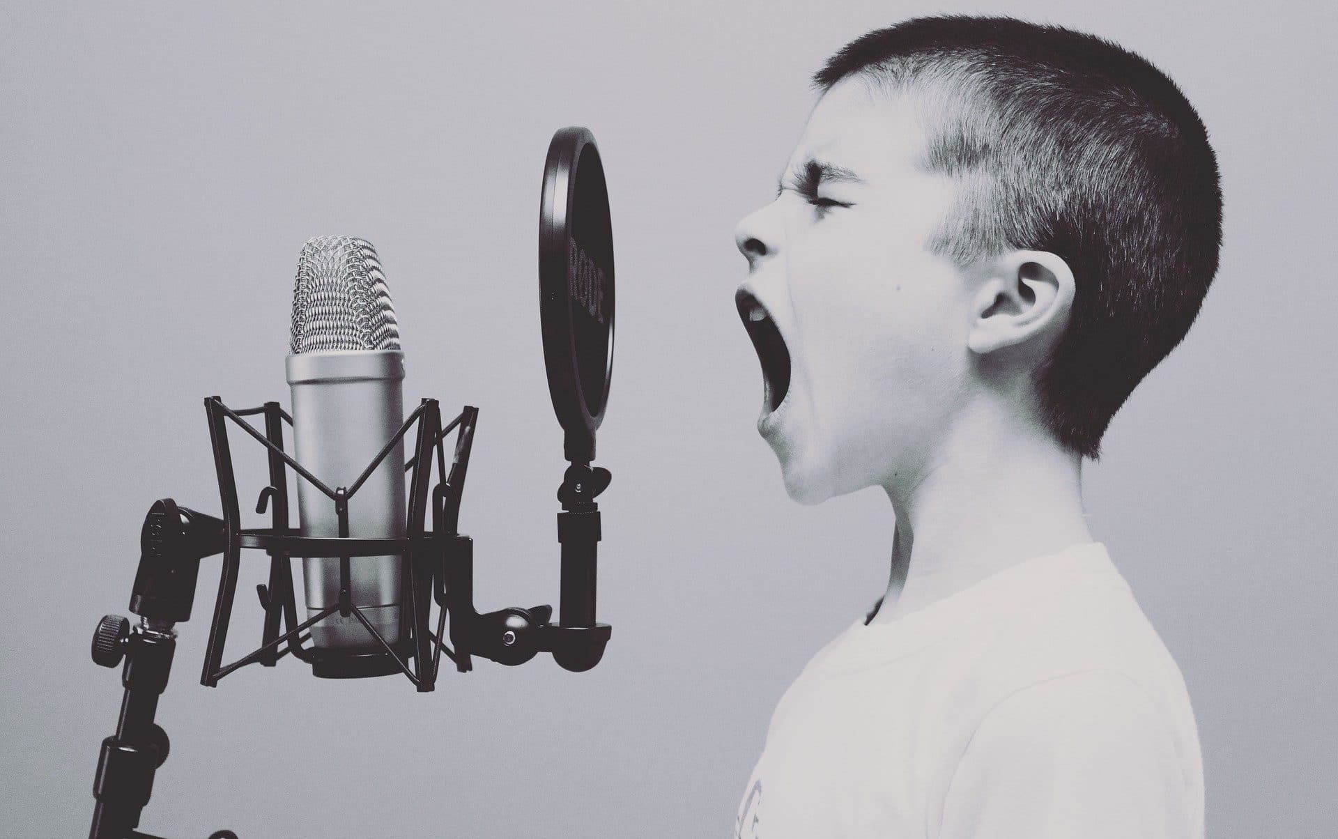 Boy singing into microphone about authentic brand purpose