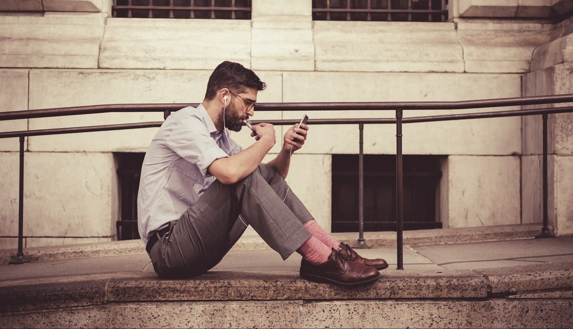 Man checking SMS marketing messages on his smartphone.