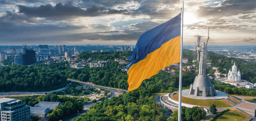 overhead view of kiev ukraine with mother monument and ukranian flag
